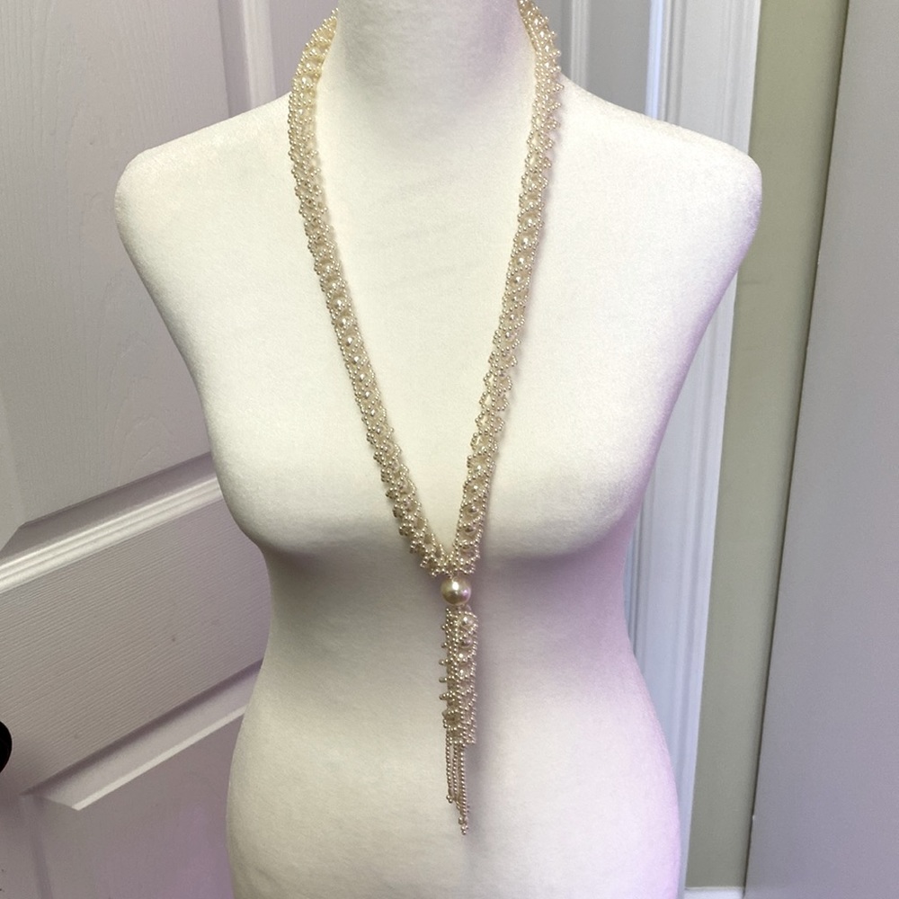 6 necklaces of various colors and lengths. Sold as a set